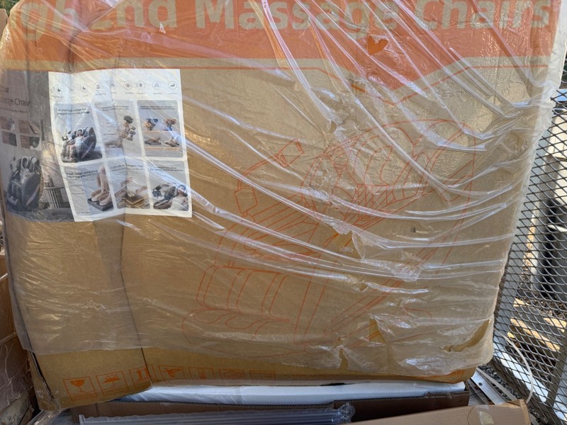 Black with gold trim high end massage chairs. Brand new in the box. gallery