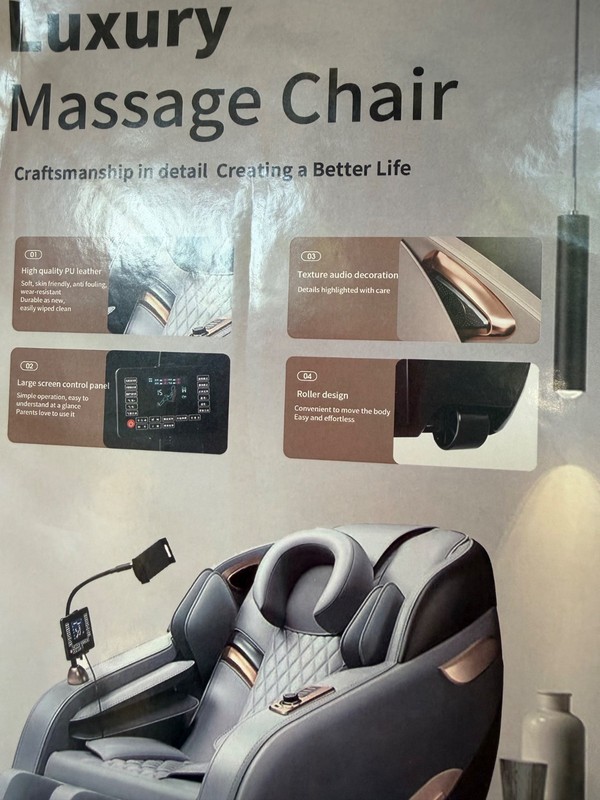 Black with gold trim high end massage chairs. Brand new in the box. gallery